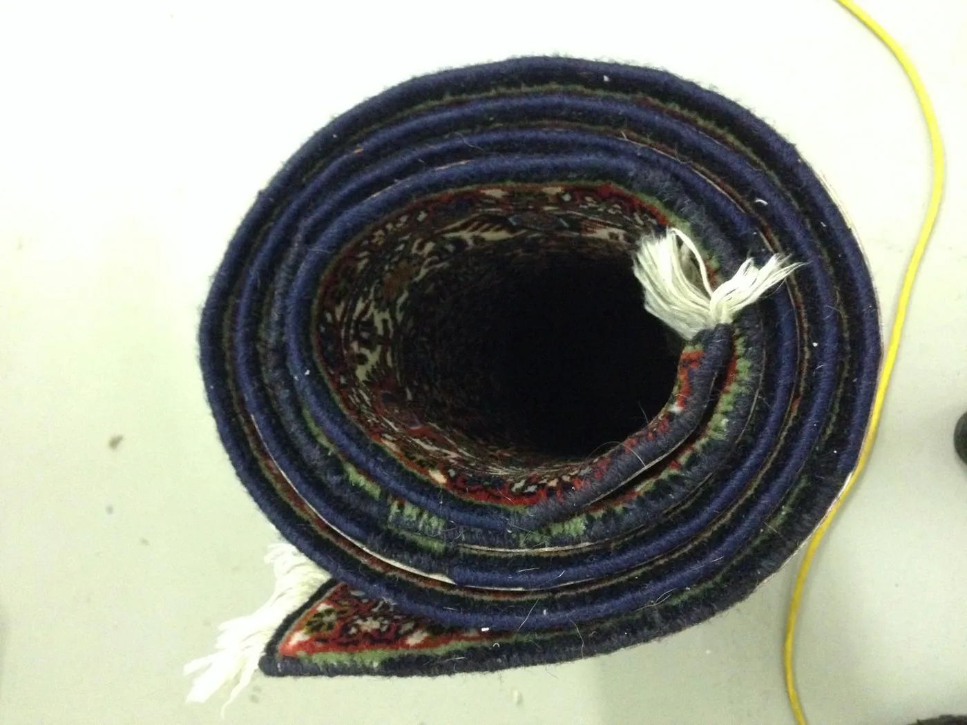 Rewoven side edge of a Persian rug after hand repair
